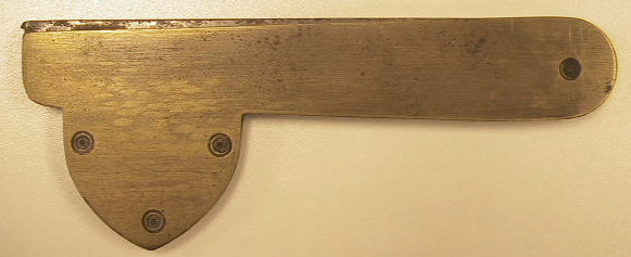 Single blade brass fleam with ebony insert, marked Williams on the blade.