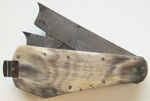Two blade fleam wiht an inset tortoise shell thumb lancet.  Items like these were thought to be used by rural families to bleed the animals and family members.  Marked Clark Newcastle