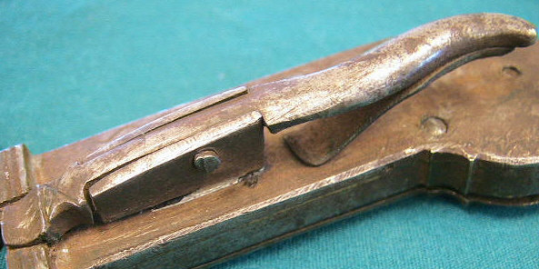 Unusual iron-cased spring lancet.  German in origin c.1810-1830.  Note the very unusual hinge mechanism for opeing and closing the compartment door.