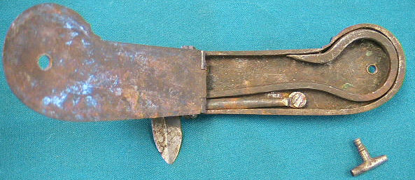 Unusual iron-cased spring lancet.  German in origin c.1810-1830.  Note the very unusual hinge mechanism for opeing and closing the compartment door.