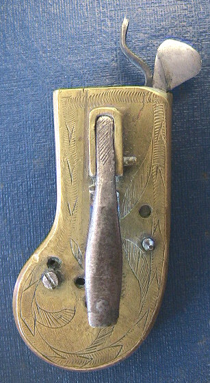 Very unusual English cased brass spring lancet with ornate floral engraving c.1800-1825.  The piece is unusual from the construction of a hinged case to allow access to the inner workings unlike the normal sliding groove design.  Another similar item in iron can be seen in the section or iron spring lancets.