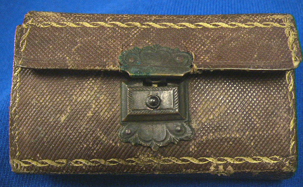 Beautiful silver cased bar release spring lancet.  The item is contained in a red leather case with gold trim.  The release is ornately tooled.  The inside of the case is marked Jackson Baltimore.  A similar item is seen on Bob Greenspan's site and is thought to have been  created by Samuel Jackson the silversmith.