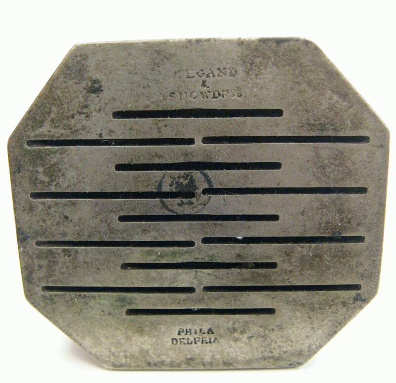 White metal 13 blade scarificator marked Wiegand & Snowden, Philadelphia.